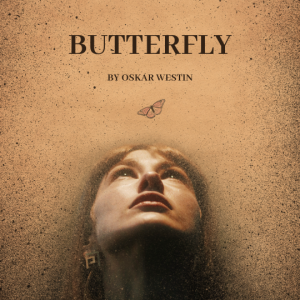 Butterfly. A red head woman staring at a floating butterfly.